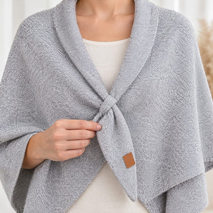 Close-up of the small front loop holding The Loop Shawl in place, light grey