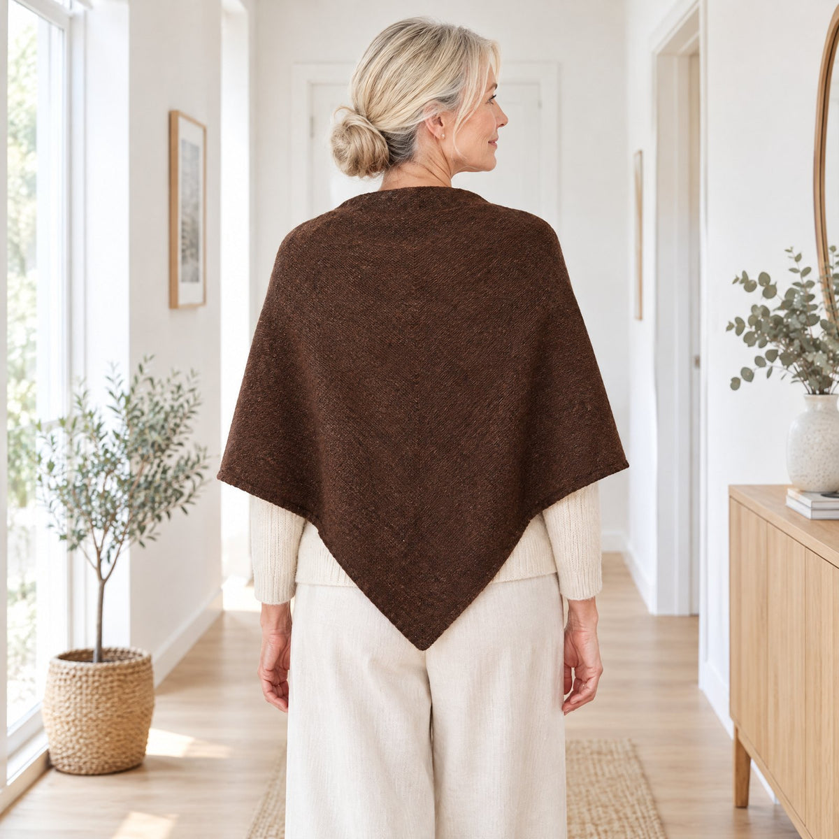 Back view of The Loop Shawl in brown draped over the shoulders