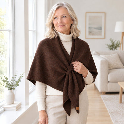 Woman wearing The Loop Shawl in brown over a cream turtleneck